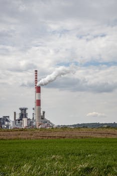 View of a power plant emitting smoke, showcasing industrial energy production.