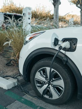 Close-up of an electric vehicle charging at a station, promoting clean energy.