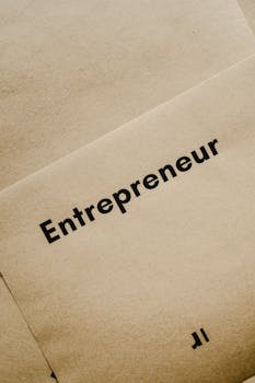 Close-up of the word 'Entrepreneur' printed on brown paper, symbolizing business innovation.